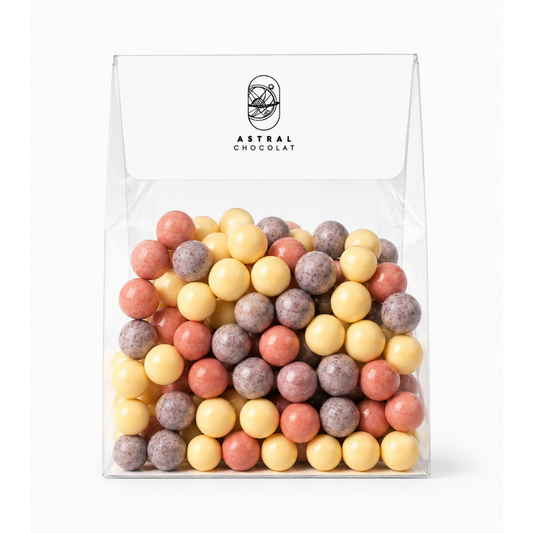 Mini billes soufflées enrobées de Chocolat Blanc et de saveurs fruitées